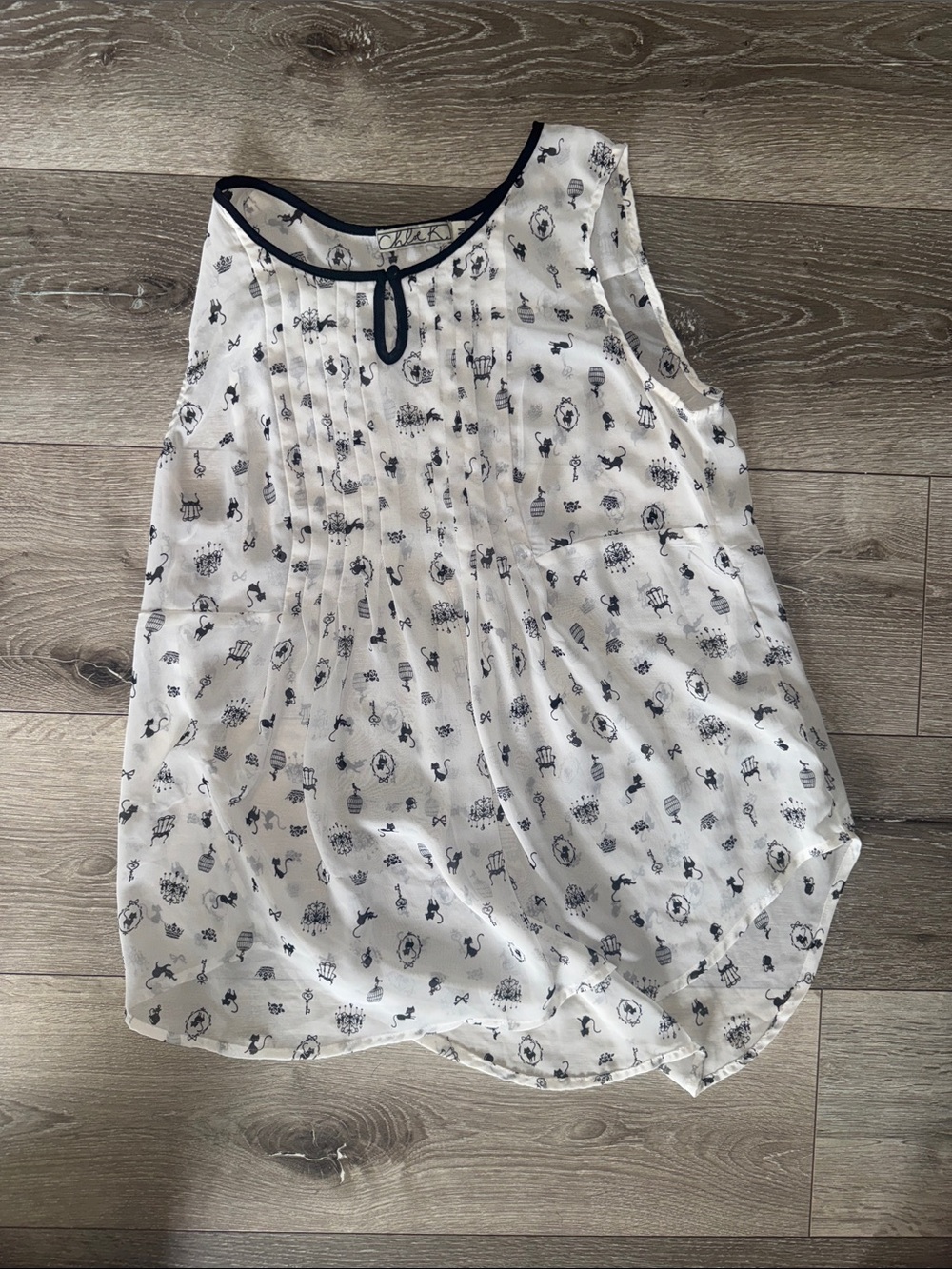 Chloe K White Camisole -size M - worn once -with black Trim and black Print.